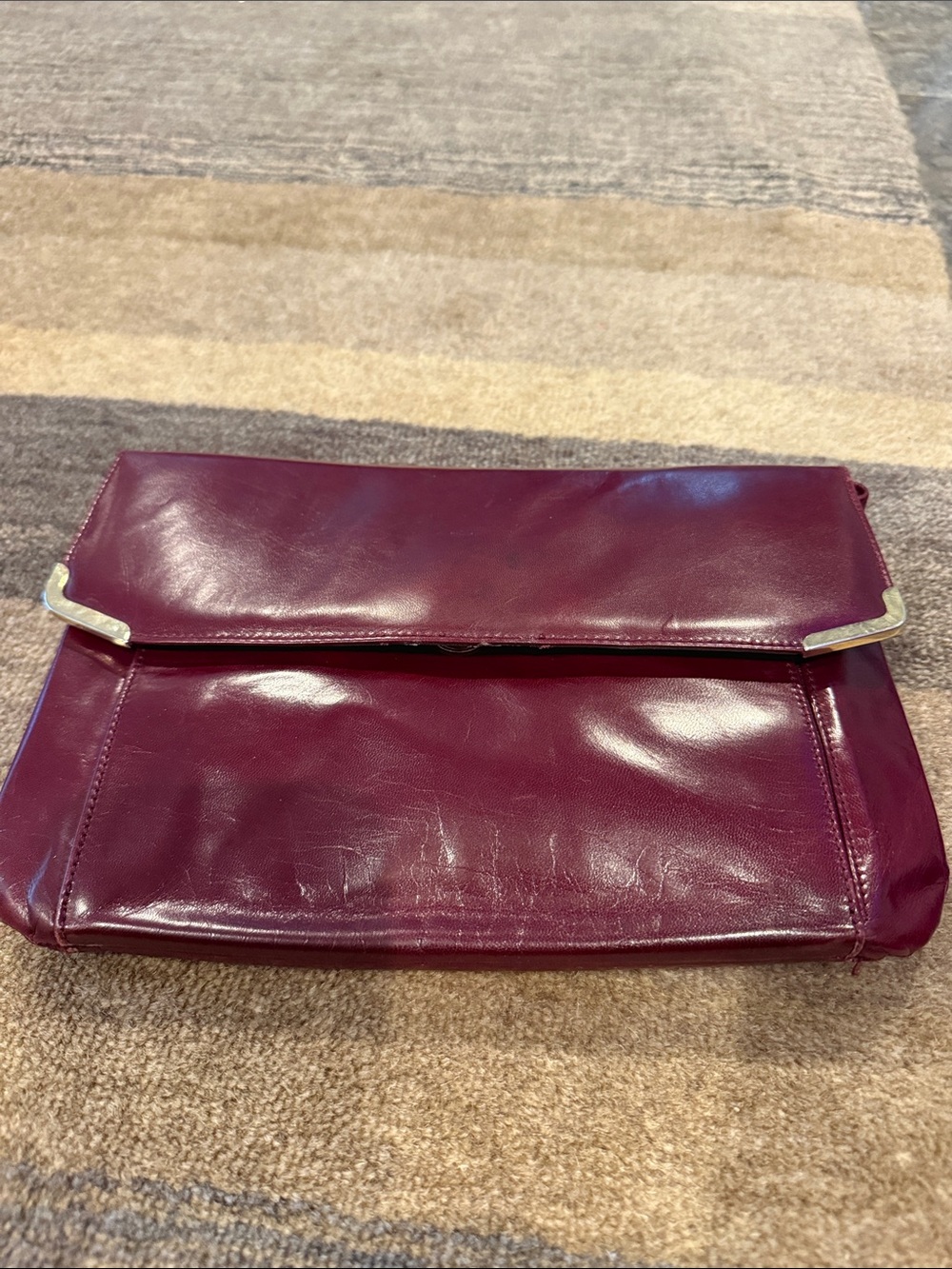 Charles Jourdan Plum Fold-Over Clutch with gold Accents